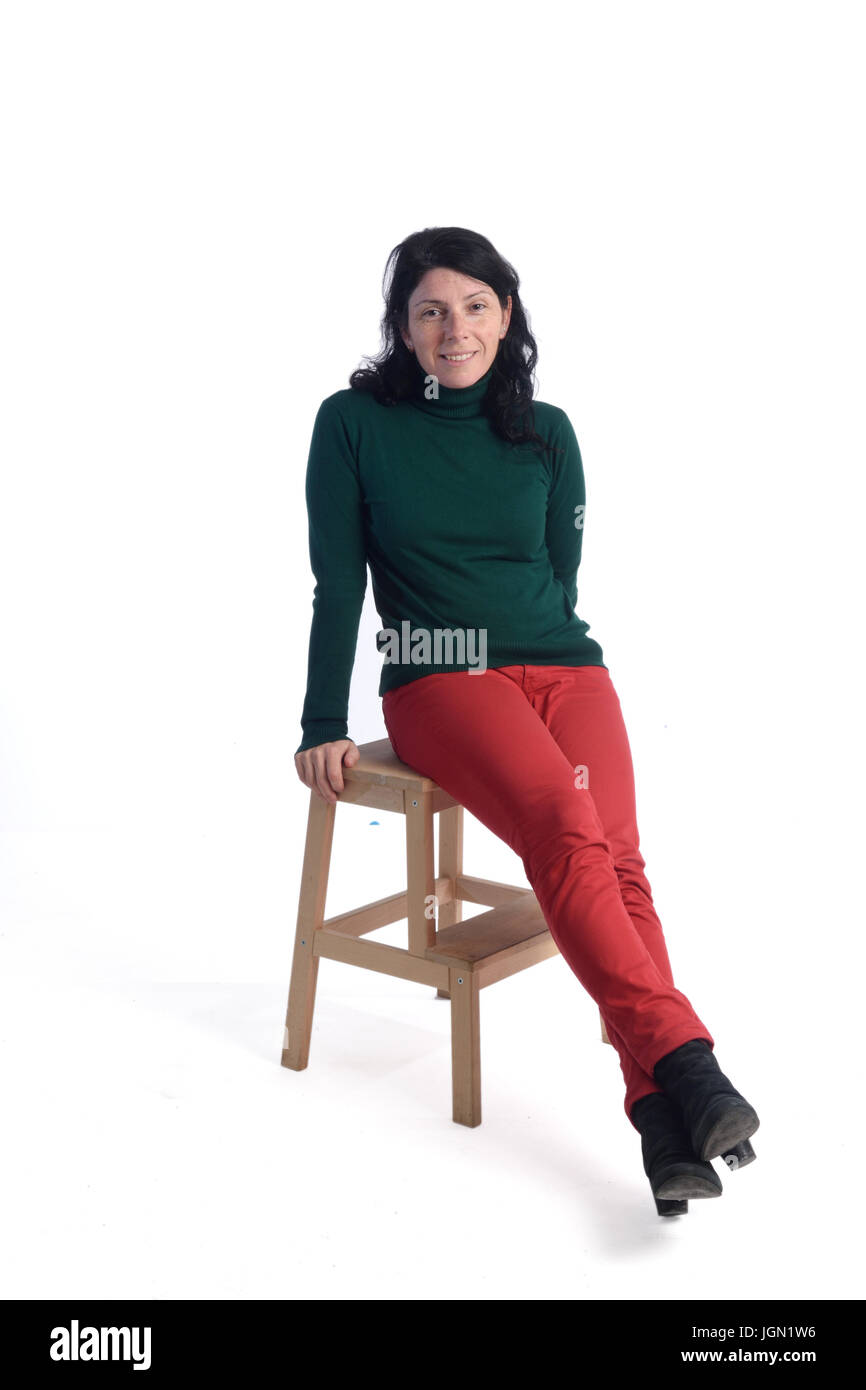 Portrait of a woman sitting with white background Stock Photo - Alamy