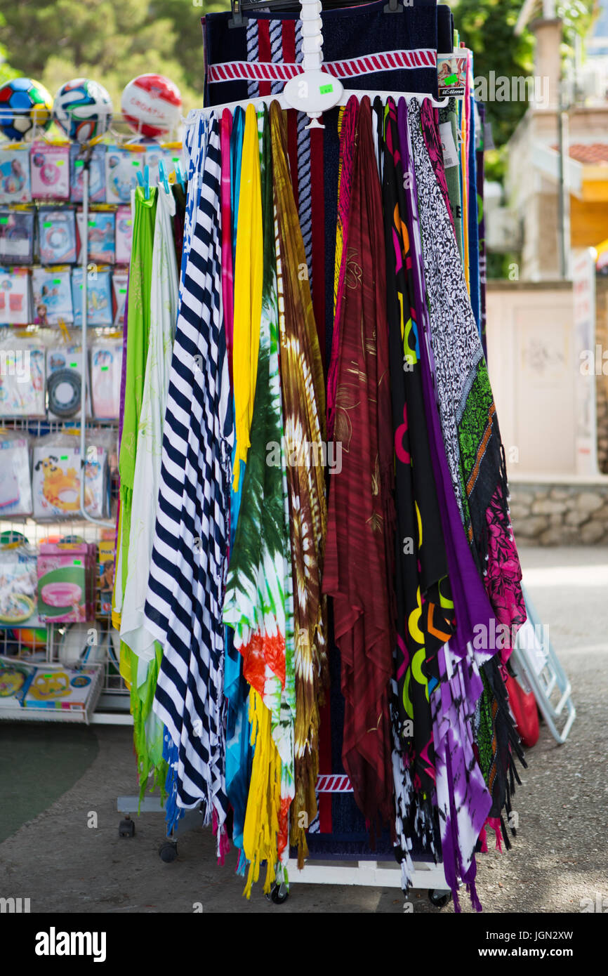 MAKARSKA,CROTIA - 16 JUNE,2017: Shawl sale in the street shop. Souvenir clothing for tourists. Buy colorful handmade wrap on the street sale Stock Photo