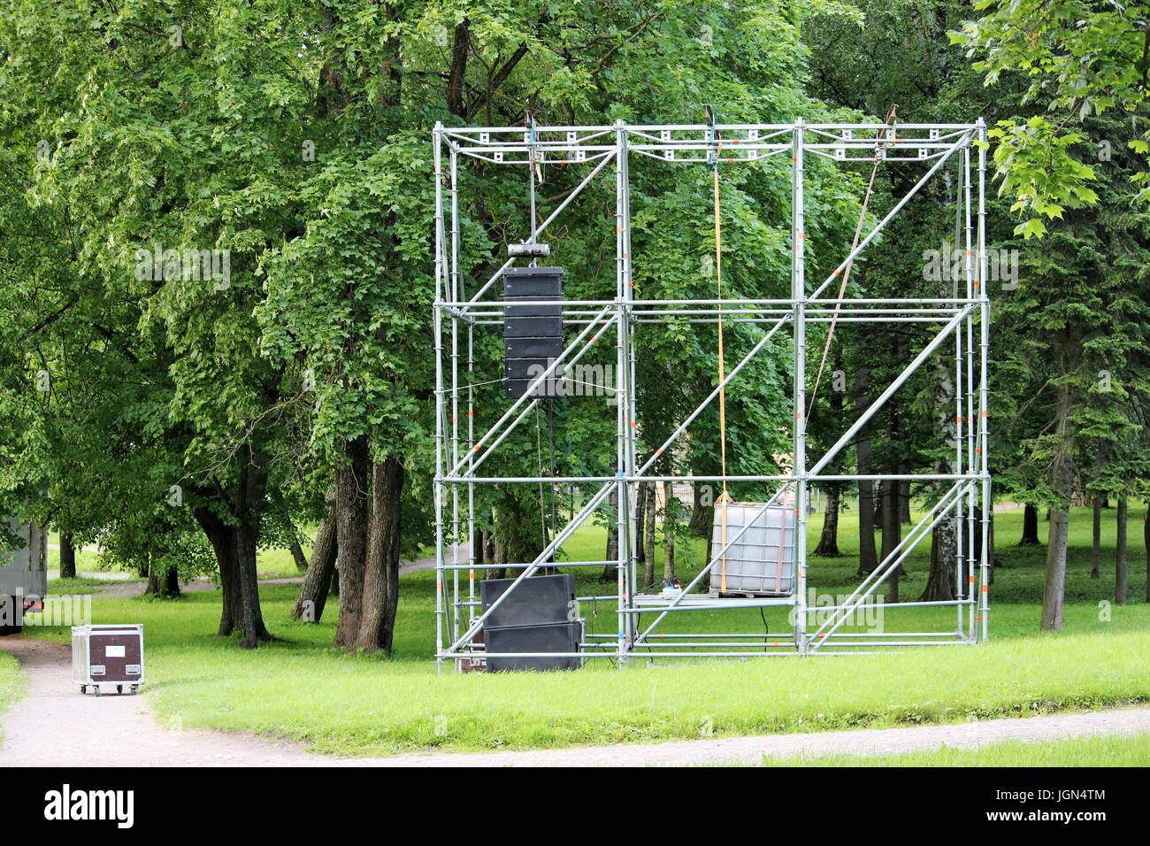Metal structure in the form of a frame for attaching musical columns and a screen for broadcasting events in the park Stock Photo