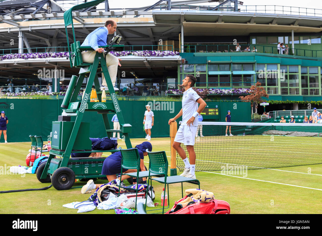 Croatian player Mate Pavic argues with the chair umpire during a men's doubles match at the Wimbledon Tennis Championships 2017, All England Lawn Tenn Stock Photo