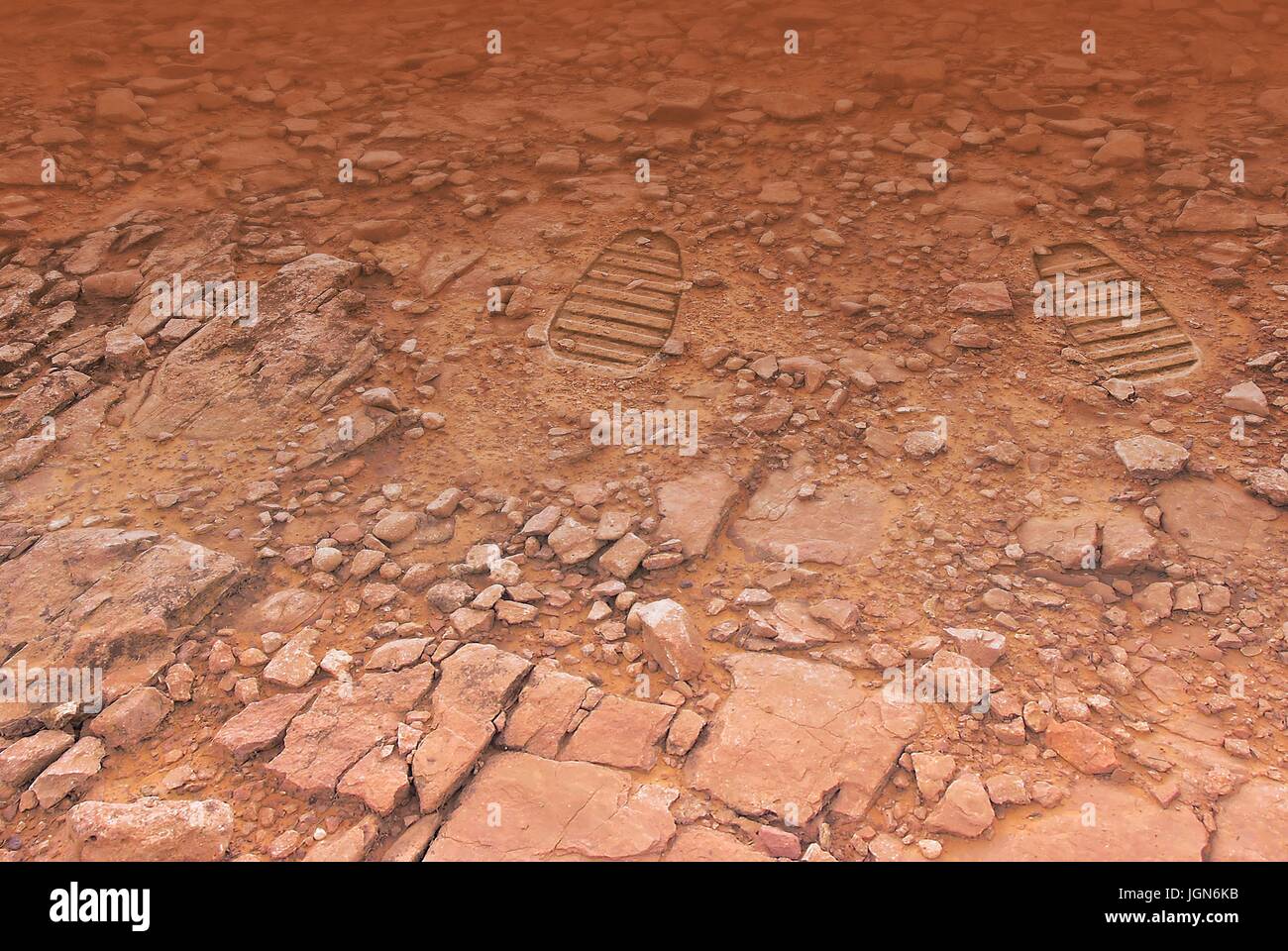 Footprints on Mars, artwork. An illustration of a pair of boot prints on the surface of the red planet, perhaps left behind by future astronauts â€“ or tourists. A human expedition to Mars would be a costly, dangerous but rewarding venture. Stock Photo