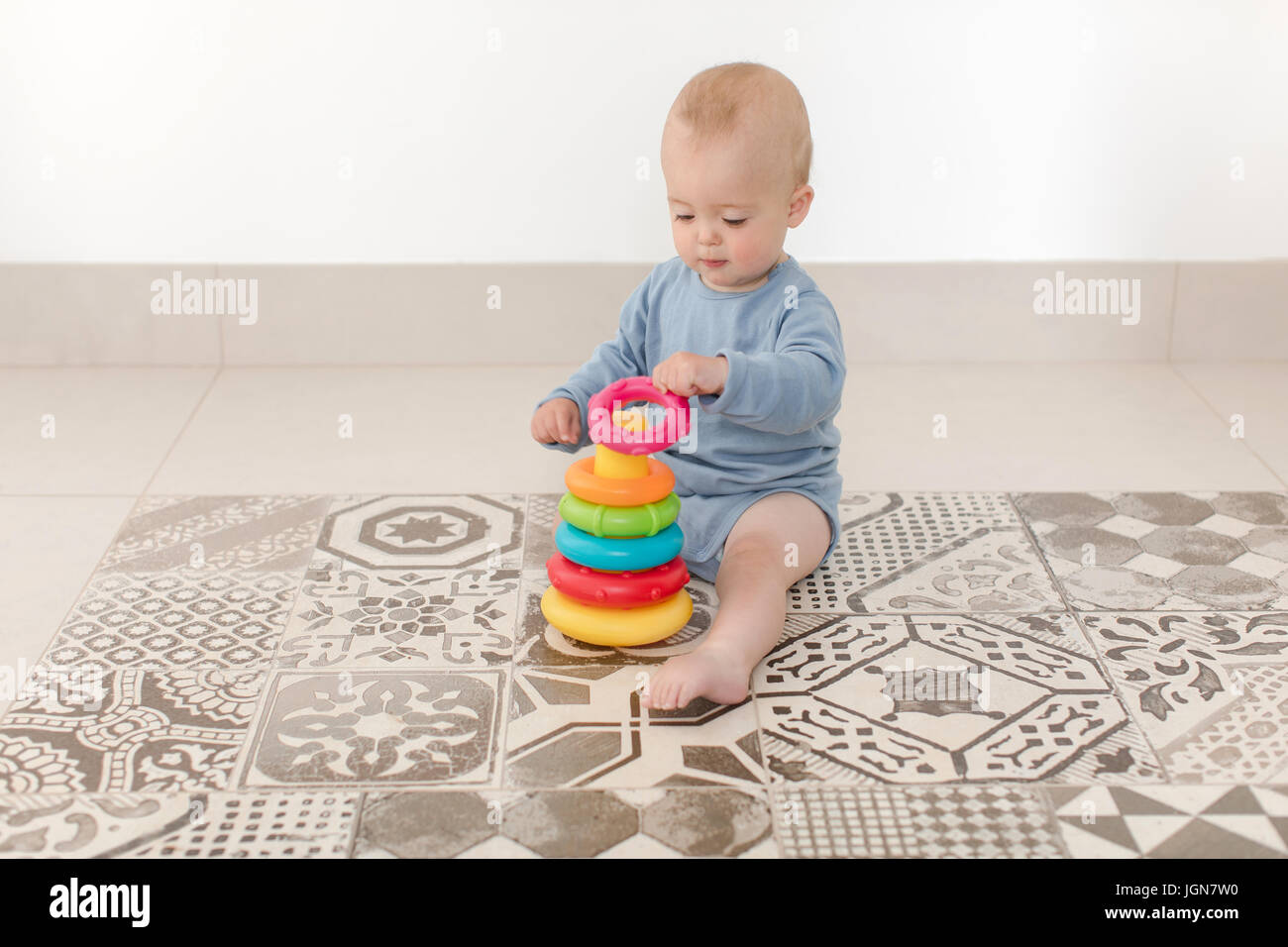Baby play with pyramid Stock Photo