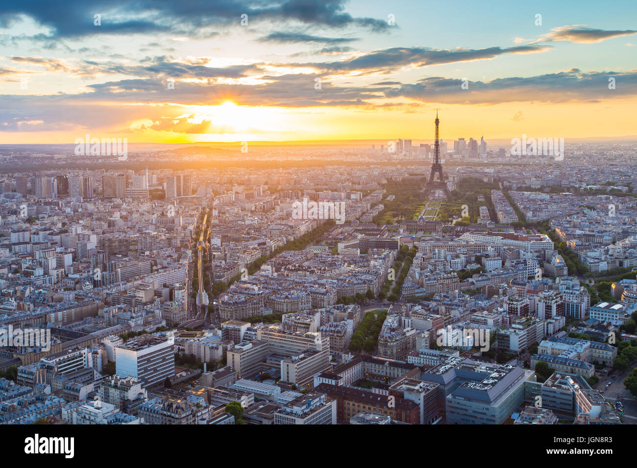 Paris city skyline rooftop view with Eiffel Tower at sunset in Paris
