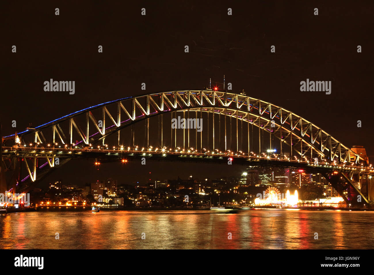 Illuminated Sydney Harbor Bridge Over Sea At Night Stock Photo - Alamy