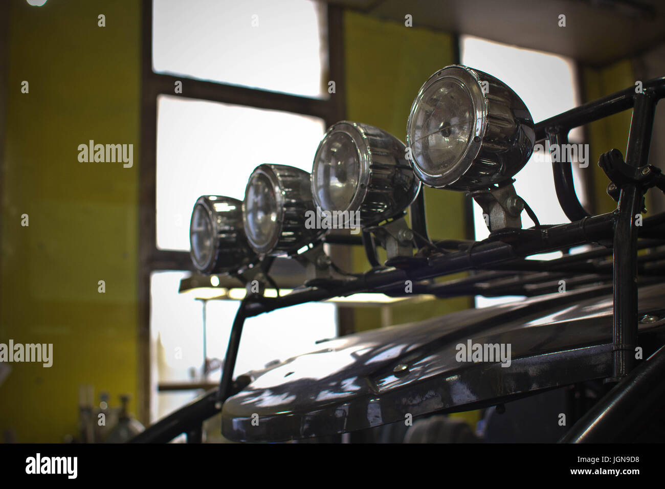 Headlights of black ATV quadbike isolated on city pavement, close up Stock Photo