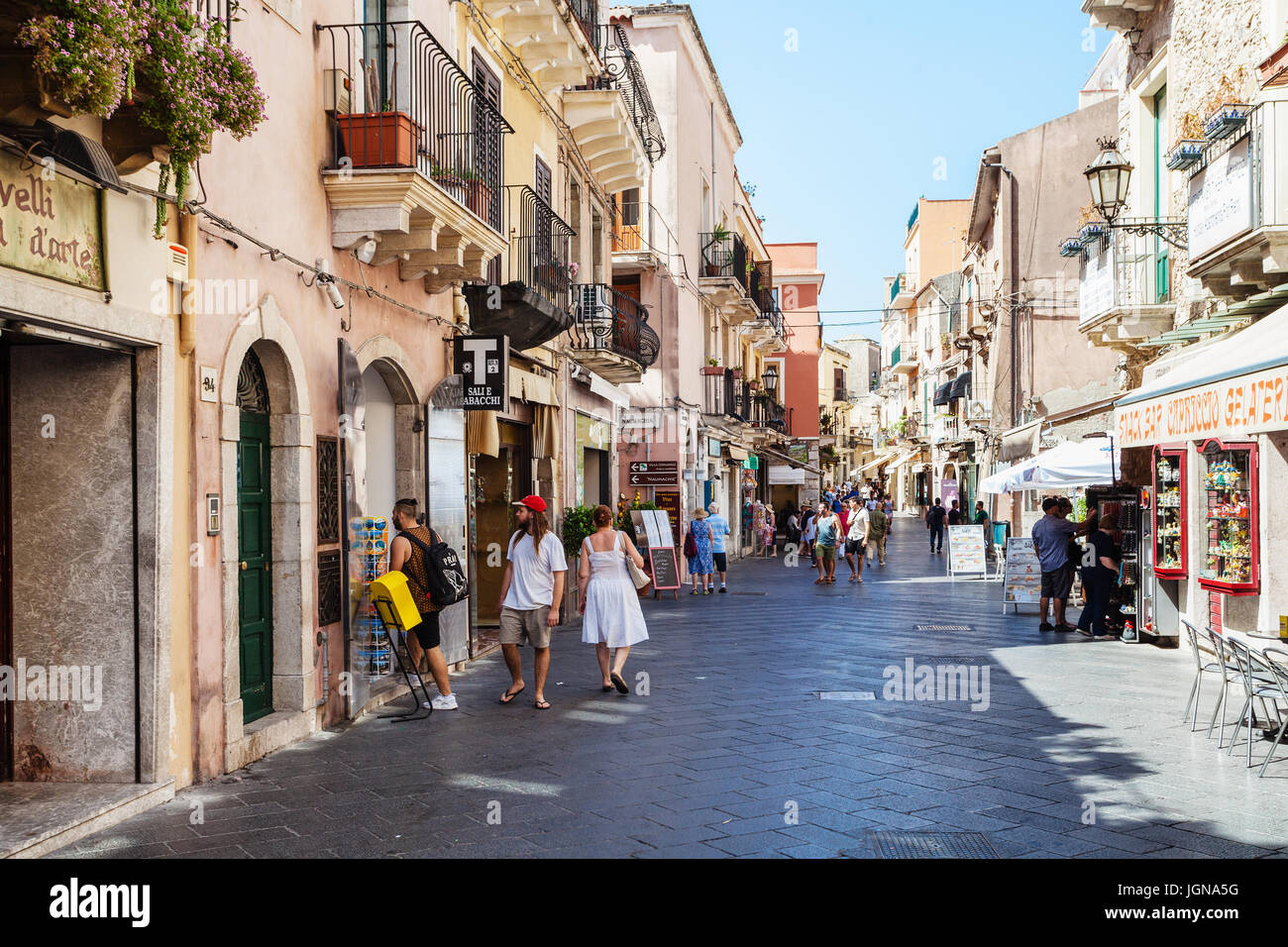 TAORMINA, ITALY - JUNE 29, 2017: people on main street Corso Umberto I in Taormina city. Taormina is resort town on Ionian Sea in Sicily Stock Photo