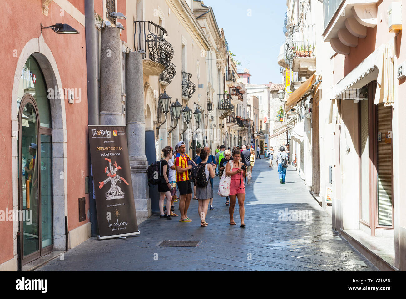 TAORMINA, ITALY - JUNE 29, 2017: visitors on main street Corso Umberto I in Taormina city. Taormina is resort town on Ionian Sea in Sicily Stock Photo