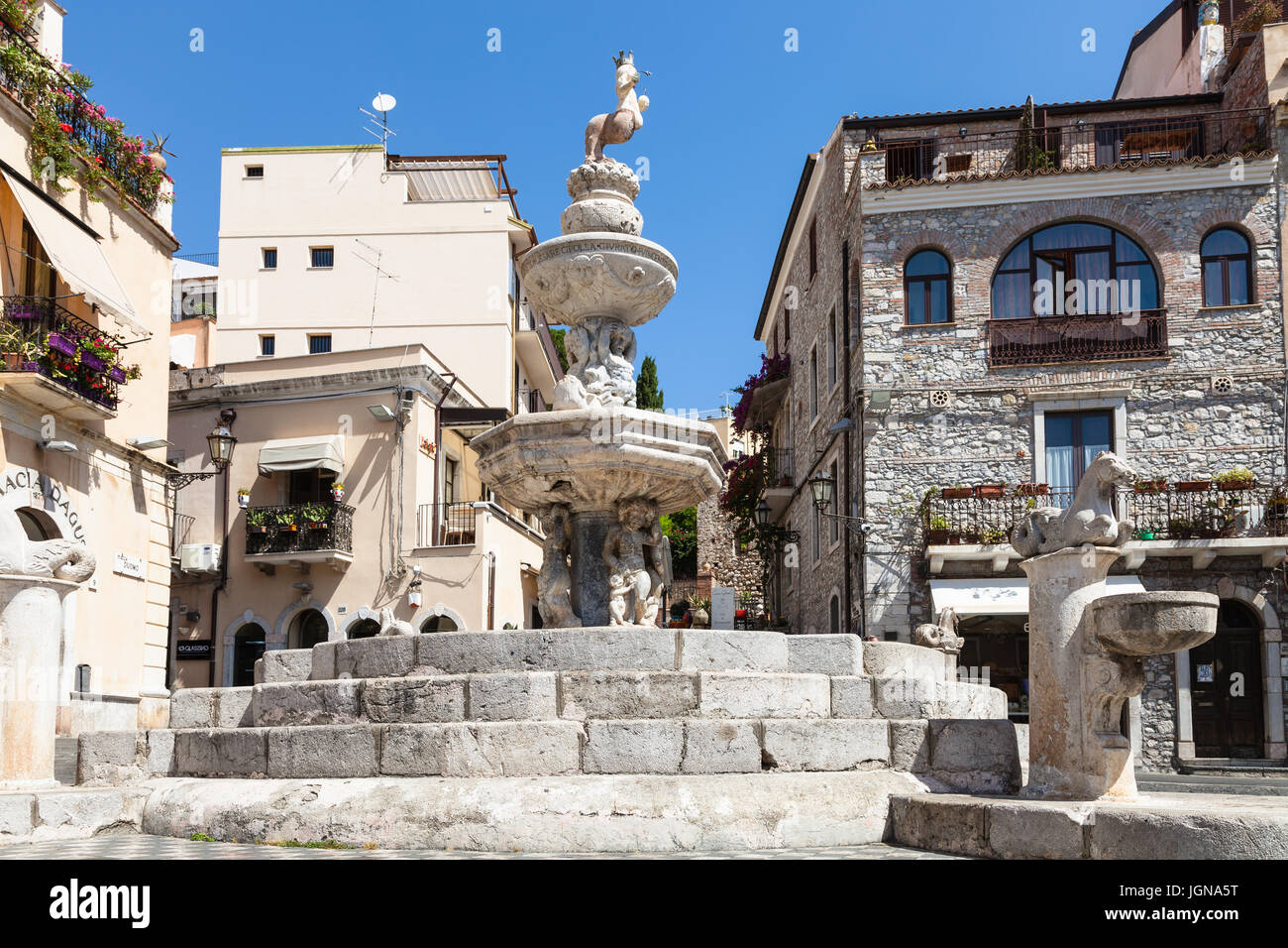 TAORMINA, ITALY - JUNE 29, 2017: baroque style fountain (Quattro Fontane di Taormina) on Piazza Del Duomo in summer day. Taormina is resort town on Io Stock Photo