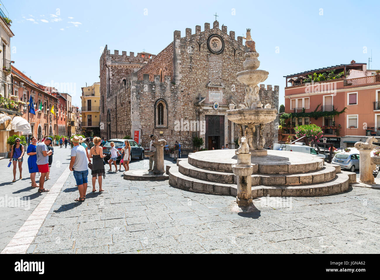 TAORMINA, ITALY - JUNE 29, 2017: people on Piazza dell Duomo near fountain in Taormina city. Taormina is resort town on Ionian Sea in Sicily Stock Photo