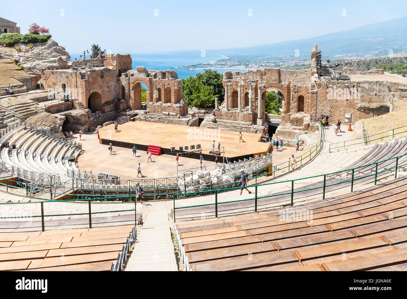 TAORMINA, ITALY - JUNE 29, 2017: people in Teatro antico di Taormina, ancient Greek Theater (Teatro Greco) in Taormina city in summer day. The amphith Stock Photo