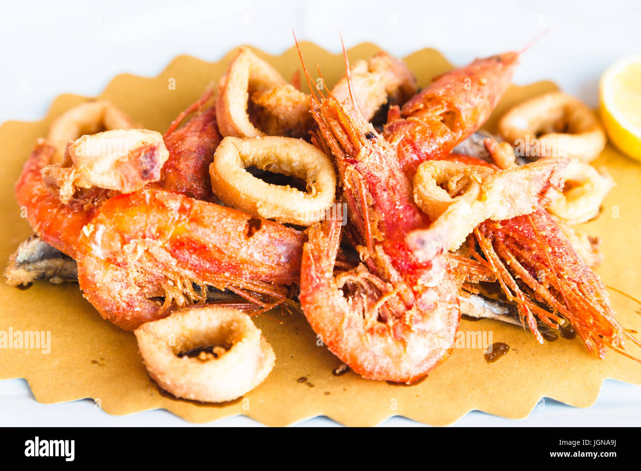 typical italian food - plate with roasted local seafood in sicilian restaurant Stock Photo