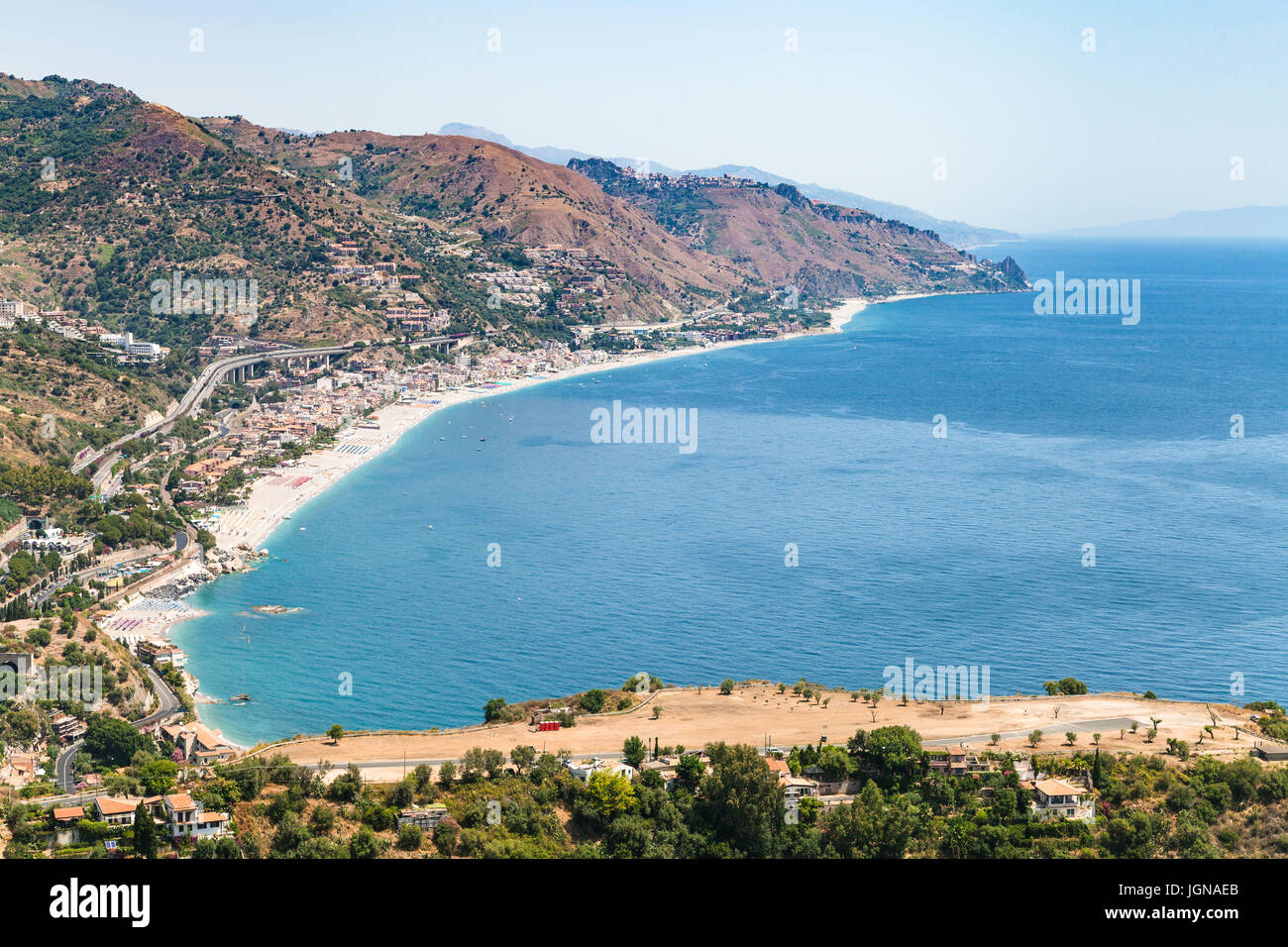 travel to Sicily, Italy - above view of Letojanni resort village of beach of Ionian Sea from Taormina city in summer day Stock Photo
