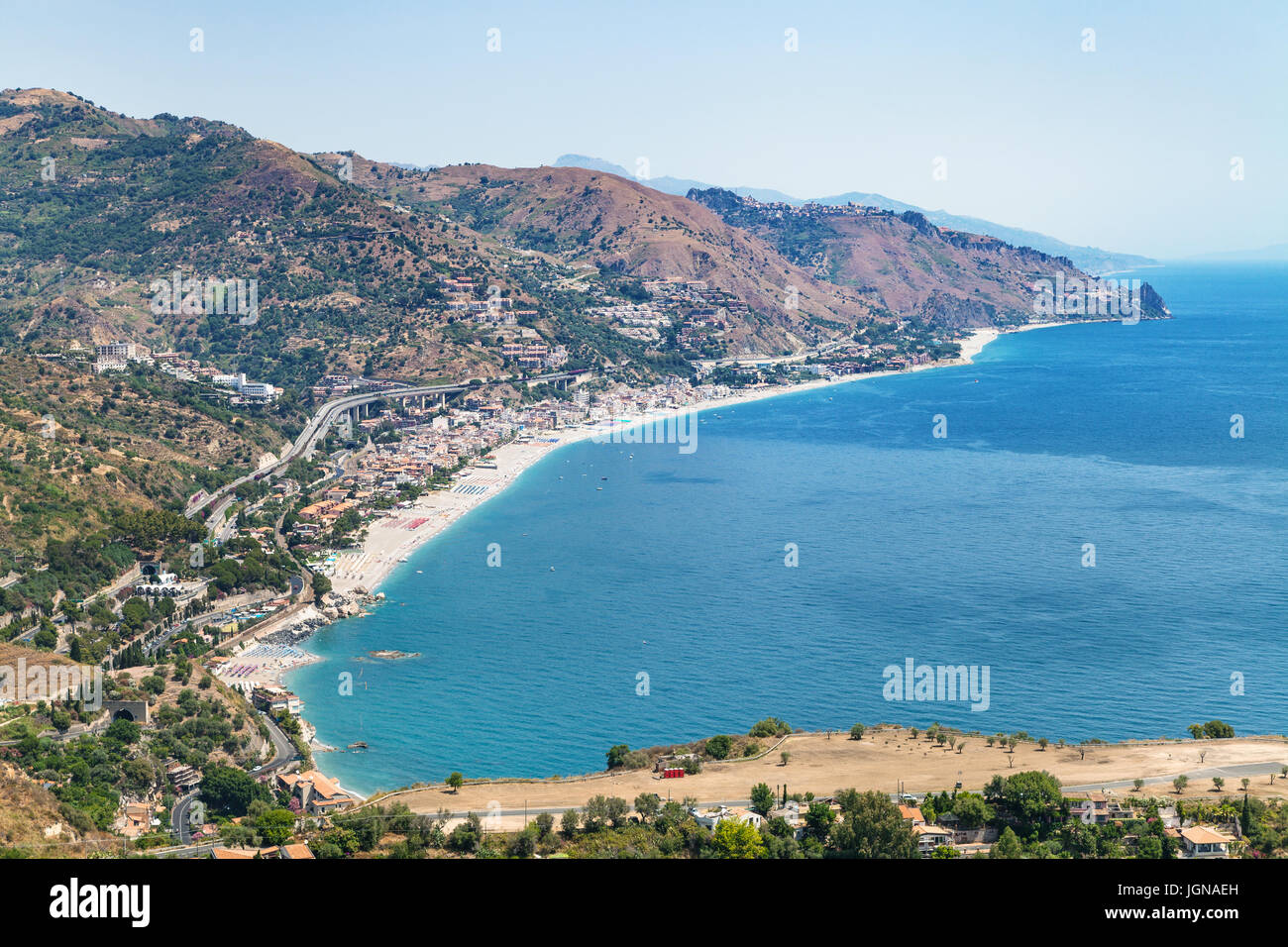 travel to Sicily, Italy - above view of Letojanni resort town of beach of Ionian Sea from Taormina city in summer day Stock Photo