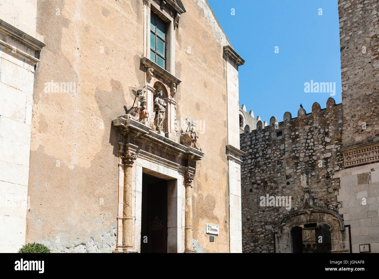 travel to Sicily, Italy - facades of church Chiesa di santa Caterina d' Alessandria and Palazzo Corvaia on square Piazza Badia in Taormina city Stock Photo