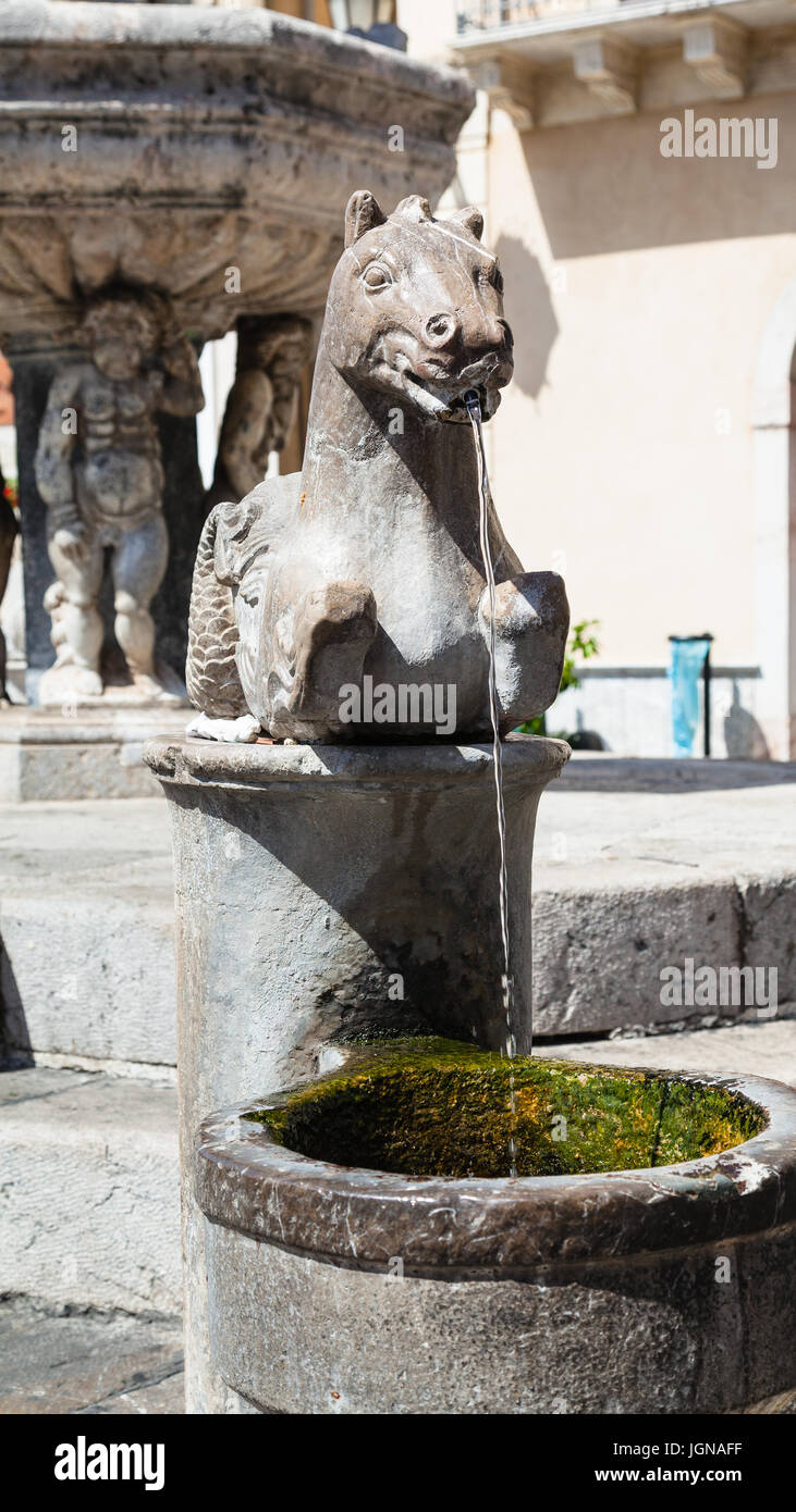 travel to Sicily, Italy - detail of baroque style fountain (4 Fontane of Taormina) on Piazza Del Duomo in Taormina city in summer day Stock Photo