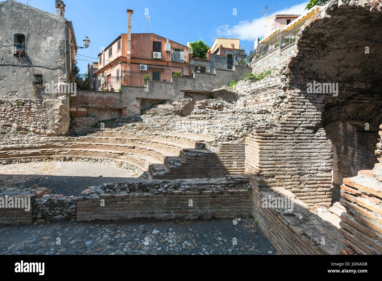 travel to Sicily, Italy - ruins of ancient roman amphitheatre Odeon in Taormina city. Stock Photo