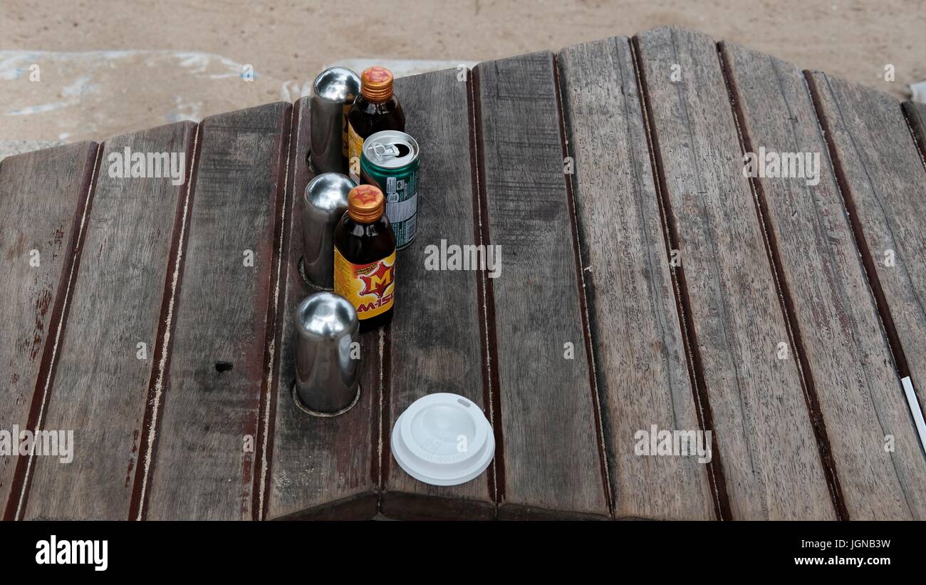 Discarded Matter Litter Trash Garbage on A Park Bench in Pattaya Thailand Stock Photo