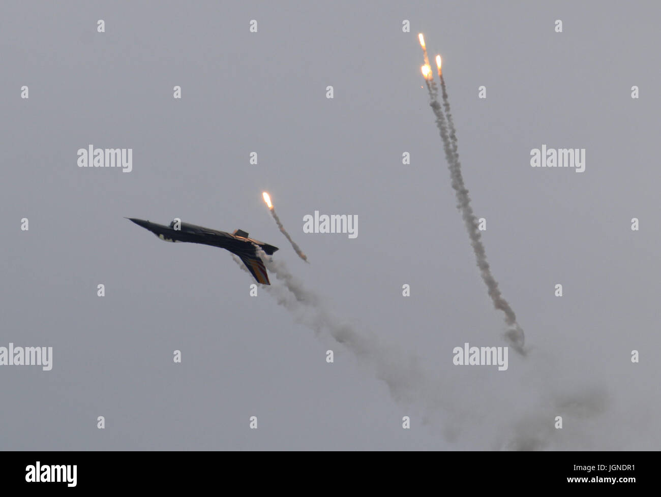 RNAS Yeovilton, Yeovilton, Somerset 8th July 2017 A Belgian Air Componrnt F-16 taking part in the Air Day releases flares from its countermeasures dispenser Credit: David Billinge/Alamy Live News Stock Photo
