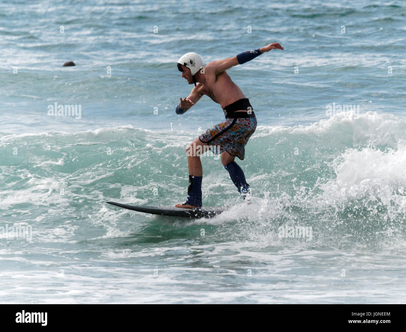 Surfing fun fancy dress surfers Stock Photo Alamy