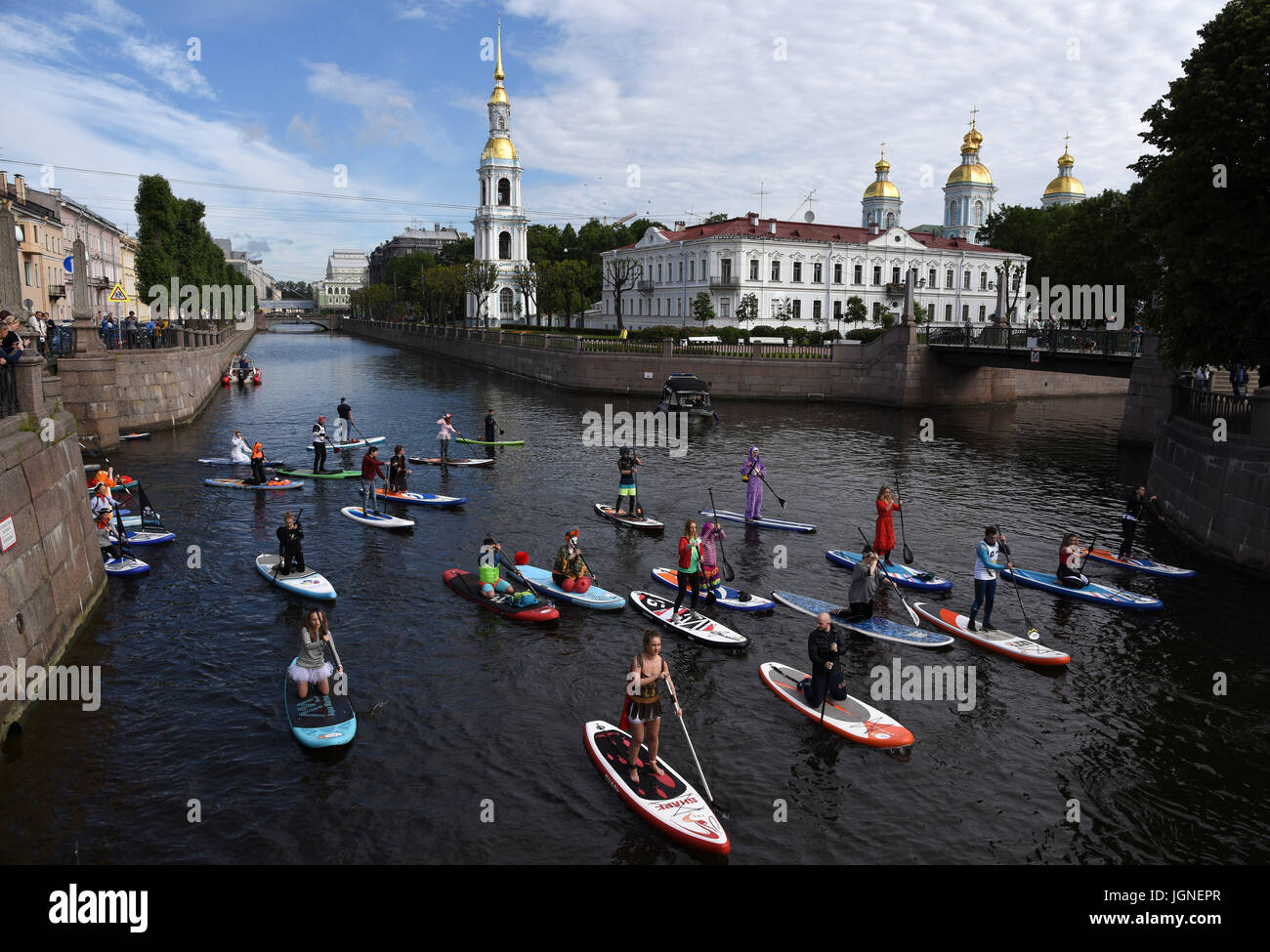St. Petersburg, Russia. 8th July, 2017. Russia, St. Petersburg, on July 8, 2017. St. Petersburg International sea festival 2017. Participants of a festival of SUP surfing on the Fontanka River, during the fancy-dress race on surfboards. More than 300 athletes and fans of driving on boards with an oar have participated in a festival. Total length of a distance will make about 10 kilometers. Credit: Andrey Pronin/ZUMA Wire/Alamy Live News Stock Photo