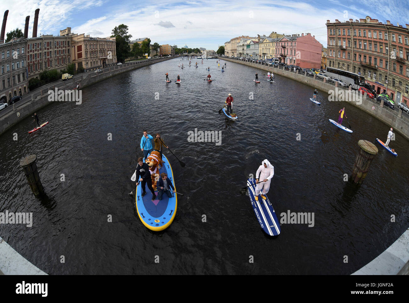 St. Petersburg, Russia. 8th July, 2017. Russia, St. Petersburg, on July 8, 2017. St. Petersburg International sea festival 2017. Participants of a festival of SUP surfing on the Fontanka River, during the fancy-dress race on surfboards. More than 300 athletes and fans of driving on boards with an oar have participated in a festival. Total length of a distance will make about 10 kilometers. Credit: Andrey Pronin/ZUMA Wire/Alamy Live News Stock Photo