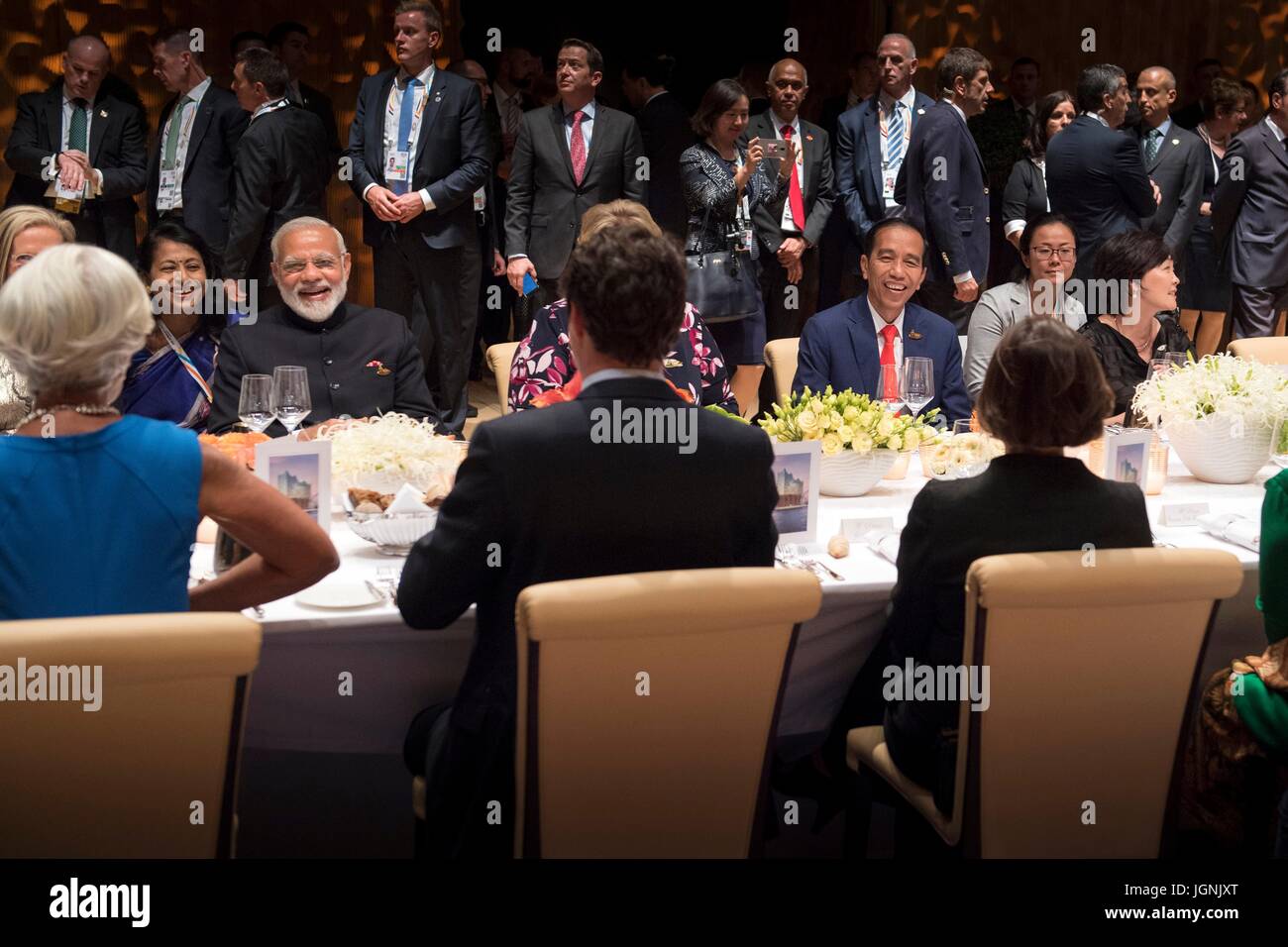 Indian Prime Minister Narendra Modi, left, and Indonesian President Joko Widodo, right, share a laugh with Canadian Prime Minister Justin Trudeau during a dinner for world leaders attending the first day of the G20 Summit meeting at the Elbphilharmonie concert hall July 7, 2017 in Hamburg, Germany.   (Bundesregierung/Bergmann via Planetpix) Stock Photo