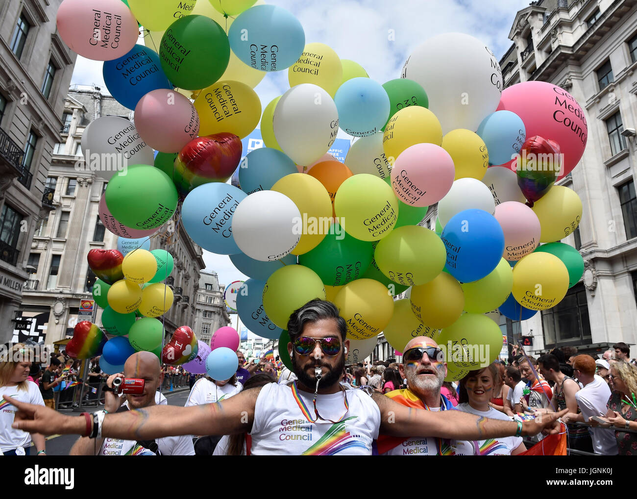 London, UK. 08th July, 2017. A member of General Medical Council holds a huge balloons during Pride In London on Saturday. Photo : Taka G Wu Credit: Taka Wu/Alamy Live News Stock Photo