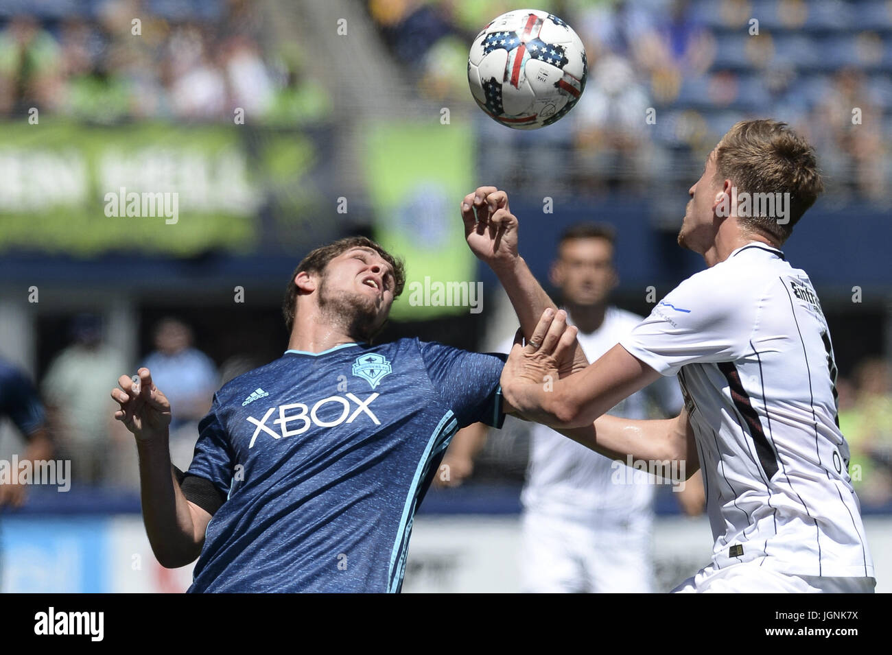 Seattle, Washington, USA. 8th July, 2017. Soccer 2017: BASTIAN OCZIPKA (6) and ZACH MATHERS (32) battle for the ball as Eintracht Frankfurt visits the Seattle Sounders for an International friendly match at Century Link Field in Seattle. Credit: Jeff Halstead/ZUMA Wire/Alamy Live News Stock Photo