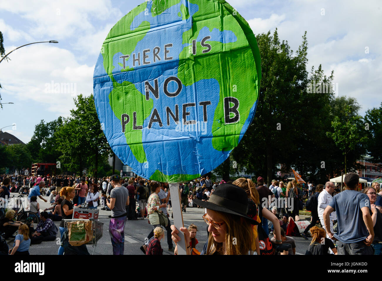 Hamburg, Germany. 8th Jul, 2017. Protest rally on St. Pauli against G-20 summit in July 2017, woman hold a banner with the globe and slogan There is no planet B,  Credit: Joerg Boethling/Alamy Live News Stock Photo