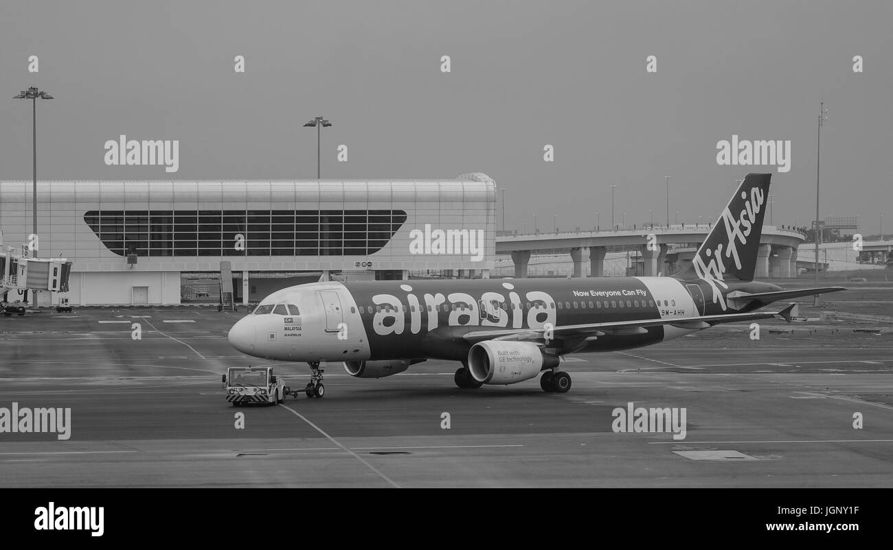 Kuala Lumpur, Malaysia - Dec 16, 2015. An AirAsia aircraft at the KLIA Airport in Kuala Lumpur, Malaysia. KLIA is the world 23rd-busiest airport by to Stock Photo