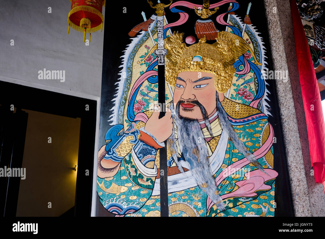 Detail of warrior guardian on front doors of Taoist Han Jiang Ancestral Temple (of the Teochew Association), George Town, Pulau Pinang, Malaysia. Stock Photo