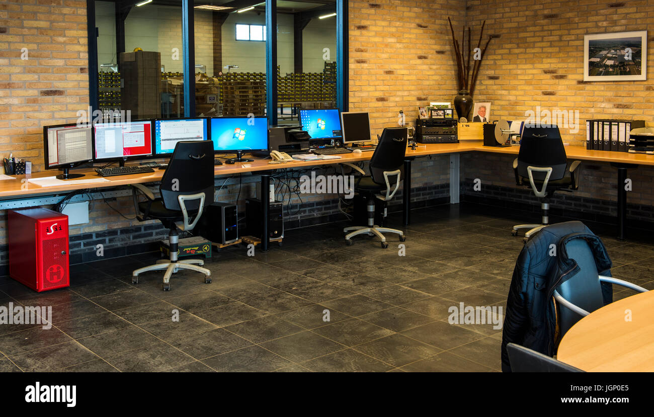 Harmelen, The Netherlands April 3, 2017 Worker at the control computers desk of a tomato