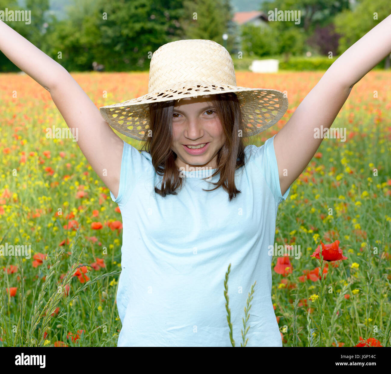 a young teenage girl in poppy field Stock Photo - Alamy