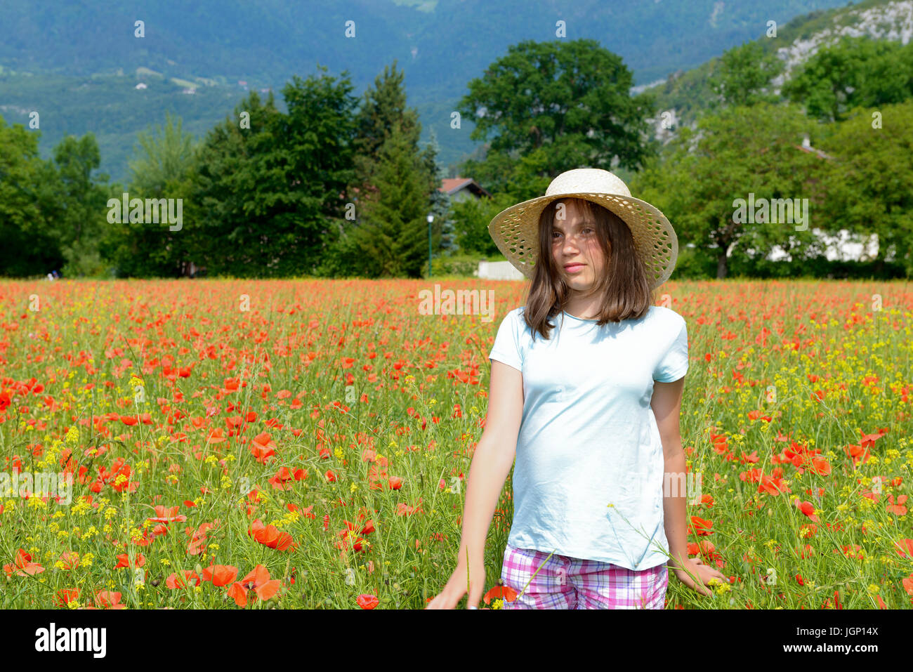 a young teenage girl in poppy field Stock Photo - Alamy