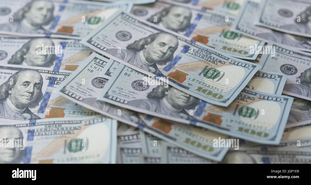 hundred dollar bills on table Stock Photo - Alamy