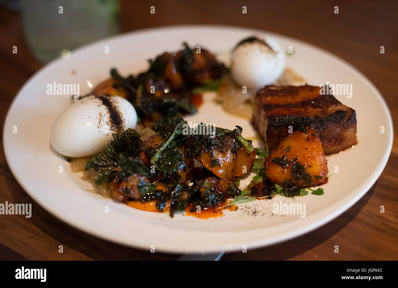 Pork Belly and Soft Boiled egg brunch entree at Chambers in SF Stock ...