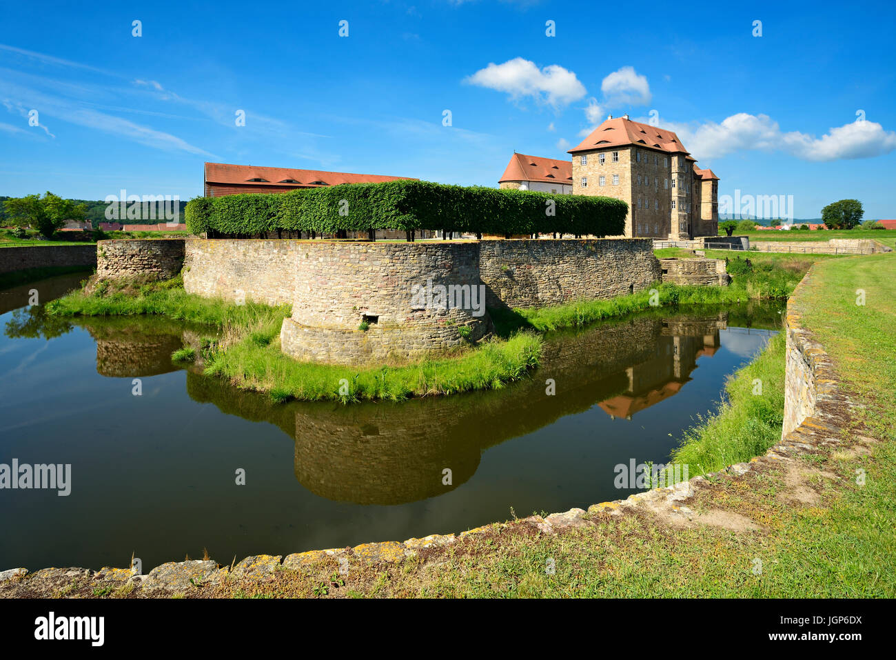 Water castle and fortress Heldrungen, gate building with bastions, exterior moat, at back the Renaissance castle, Heldrungen Stock Photo