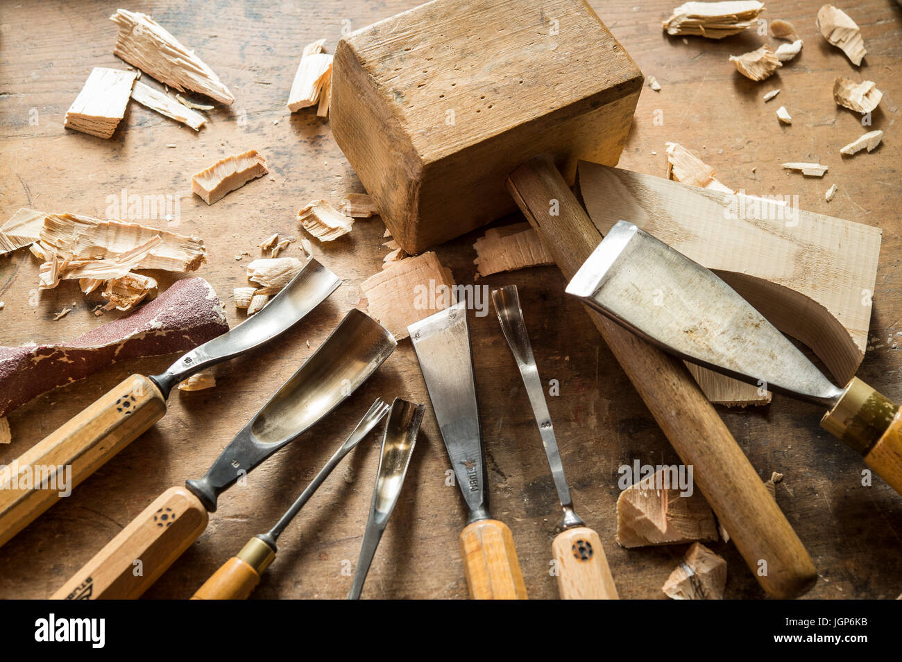 Various woodworking tools on a workbench, wooden mallet and wood carving knives, wooden mask carver, Bad Aussee, Styria, Austria Stock Photo