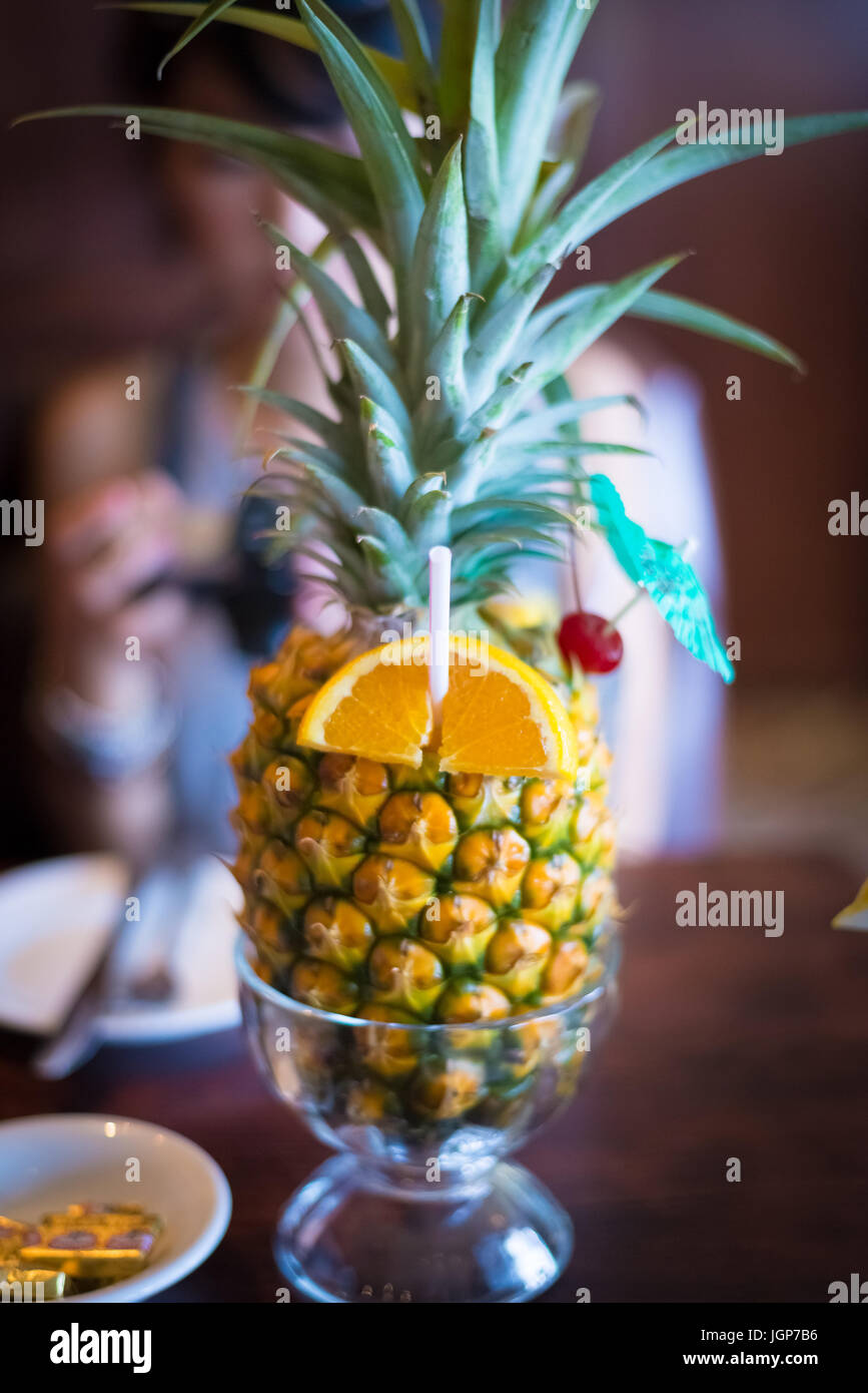 Fruity alcoholic drink served in a pineapple Stock Photo Alamy