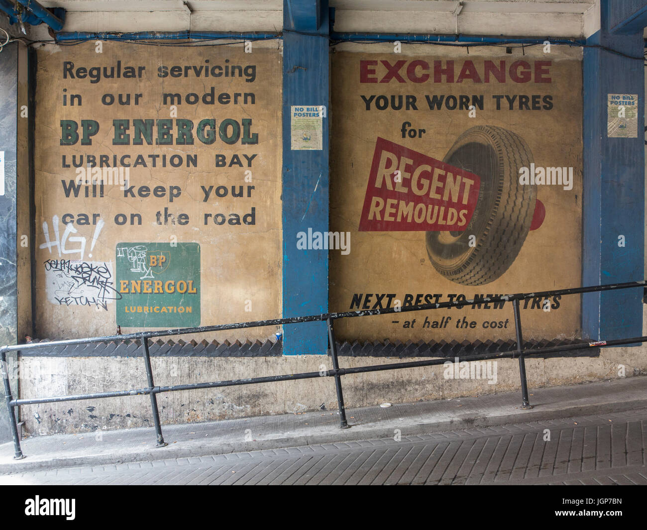 Old ghost signs for car parts in Soho, London Stock Photo