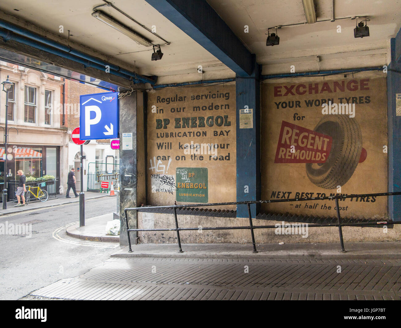 Old ghost signs for car parts in Soho, London Stock Photo