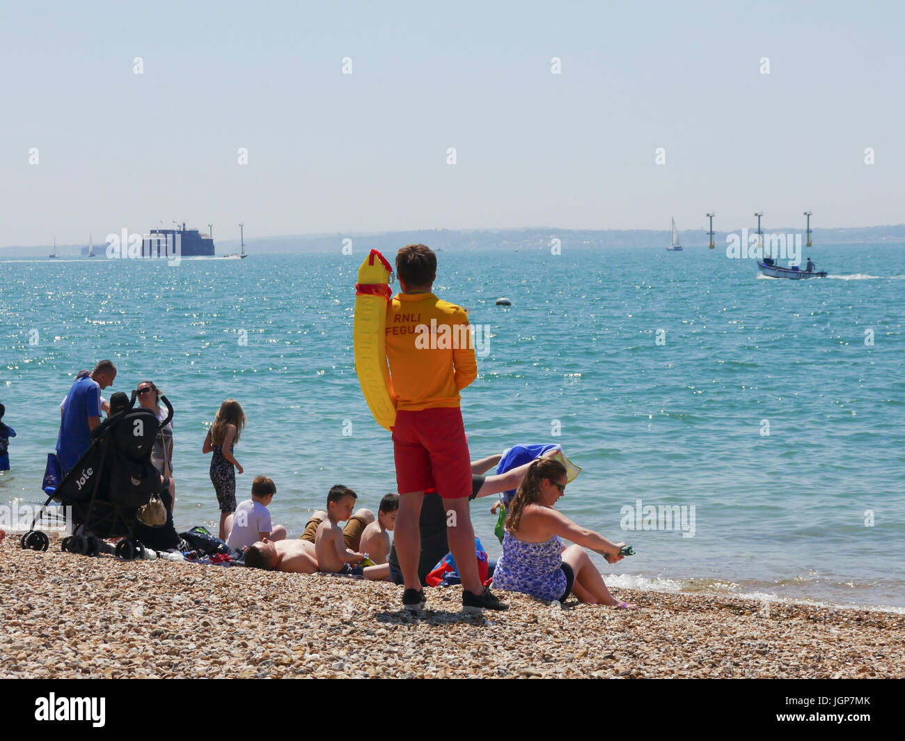 A Royal Life Saving Society lifeguard watches over southsea beach Stock Photo