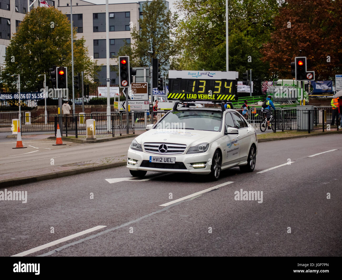 A Race Timing Car Leading A Running Race Stock Photo Alamy a-race-timing-car-leading-a-running-race-stock-photo-alamy