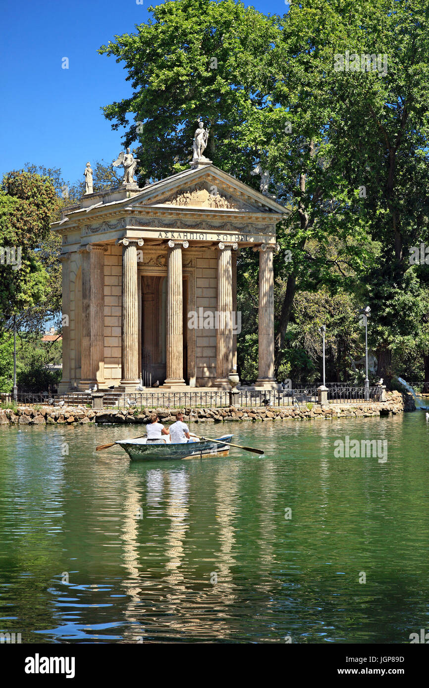 Visitors rowing their boats in the lake of the Villa Borghese gardens ...