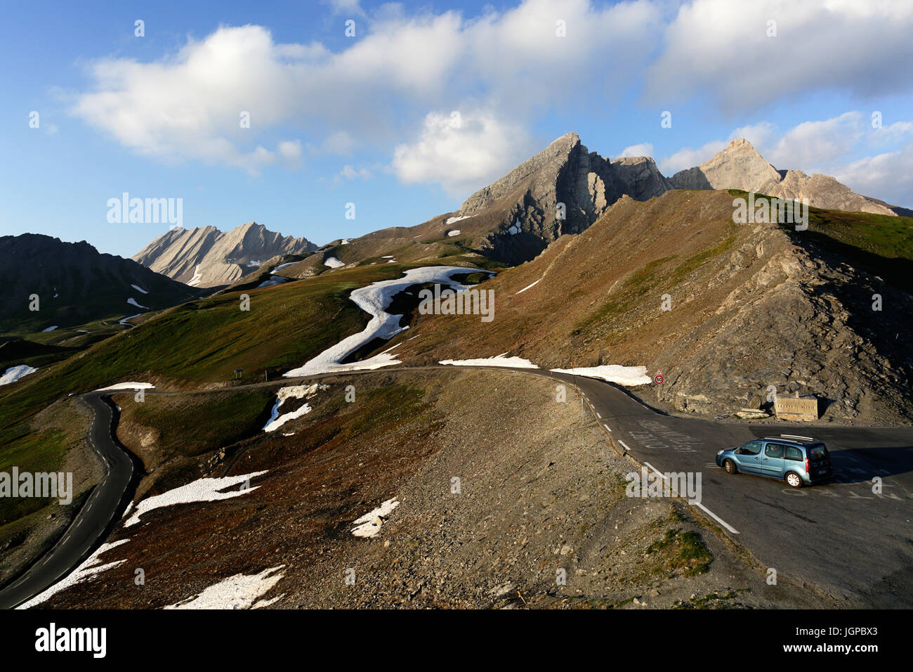 Car on a scenic mountain road in french alps, Col Agnel, France. Stock Photo