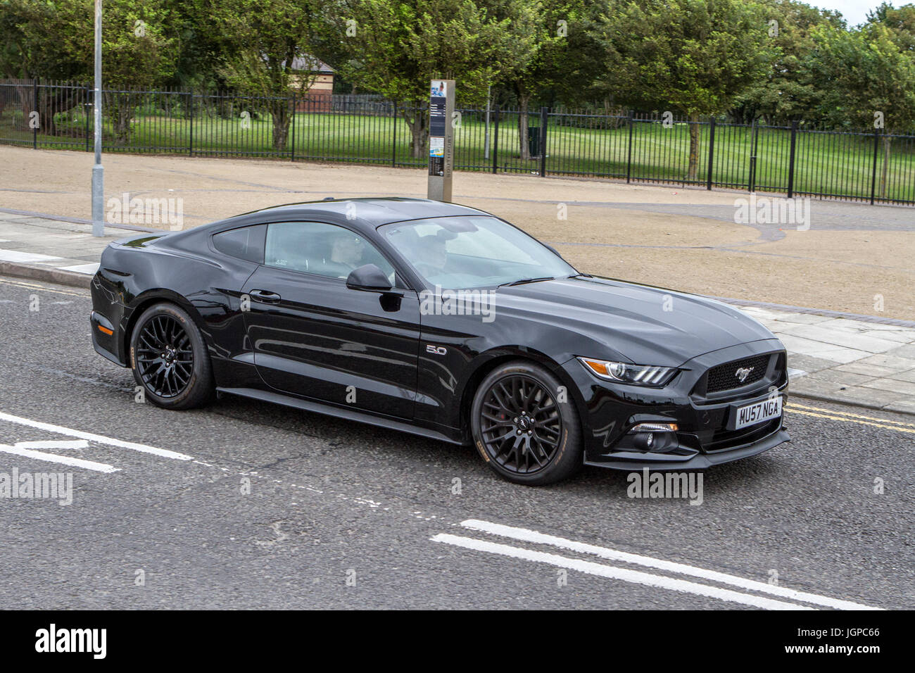 Blurred moving car Shelby FORD MUSTANG GT AUTO American muscle car Slow camera shutter speed vehicle movement Stock Photo