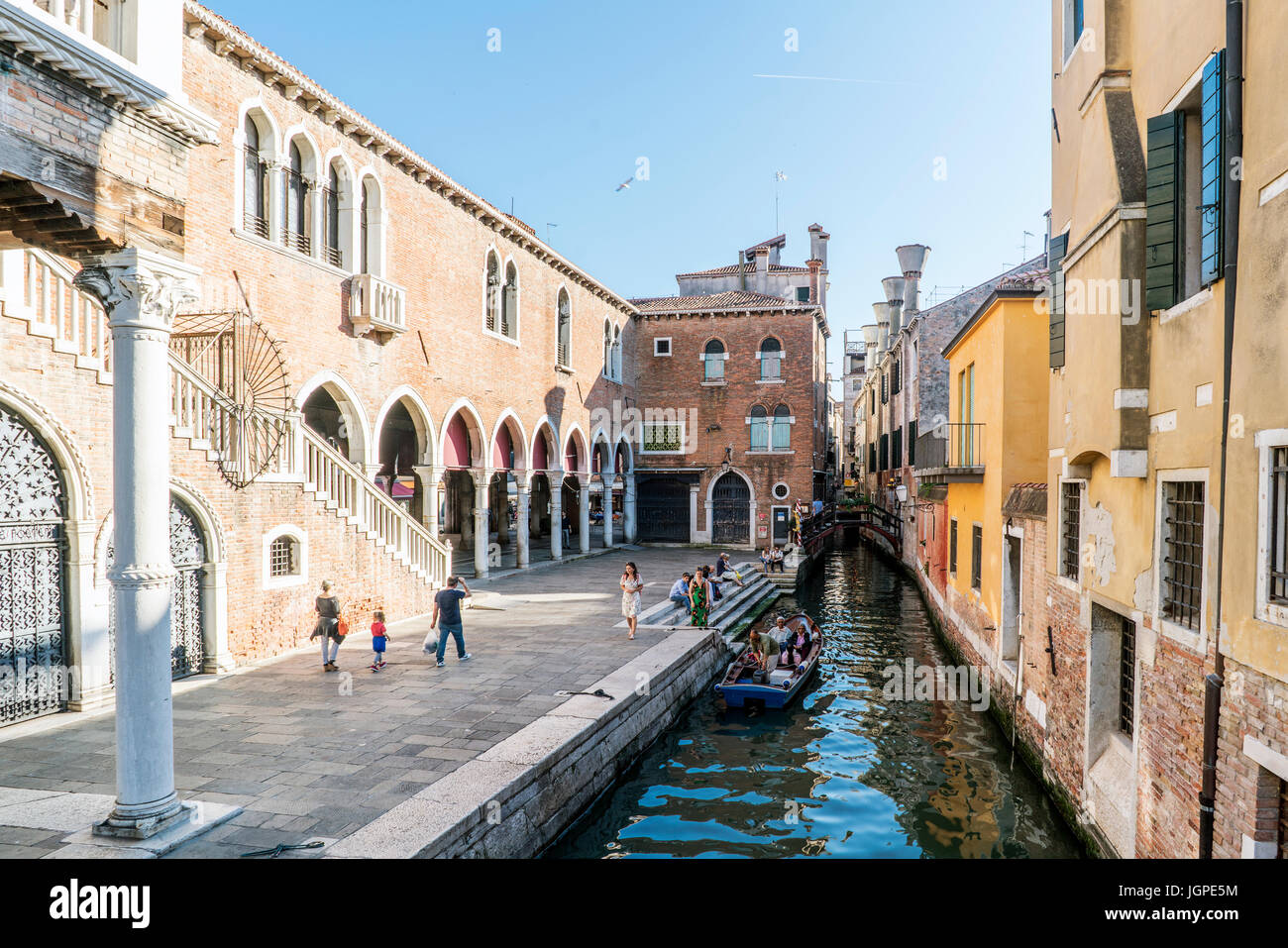 Venice, Veneto, Italy. May 21, 2017: Narrow channel next to the fish market near the street called "de la Pescaria" Stock Photo