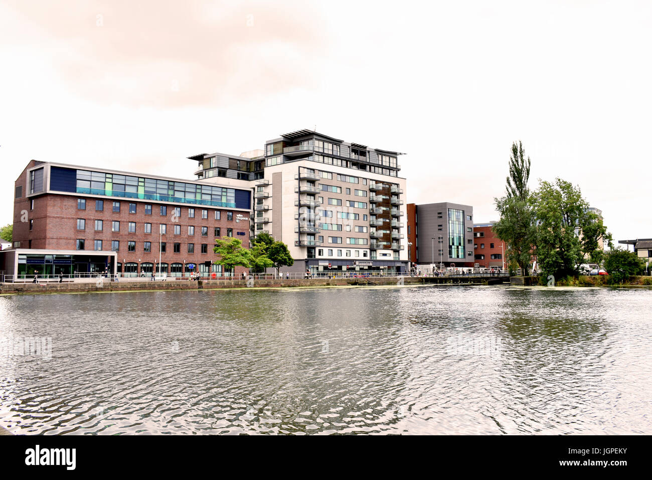 A shot of various buildings on the other side of the river, opposite the University of Lincoln Stock Photo