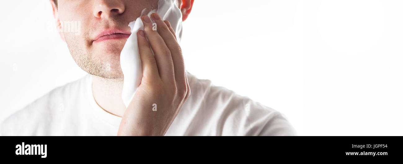 man with shaving foam on his face, Morning ritual operation Stock Photo
