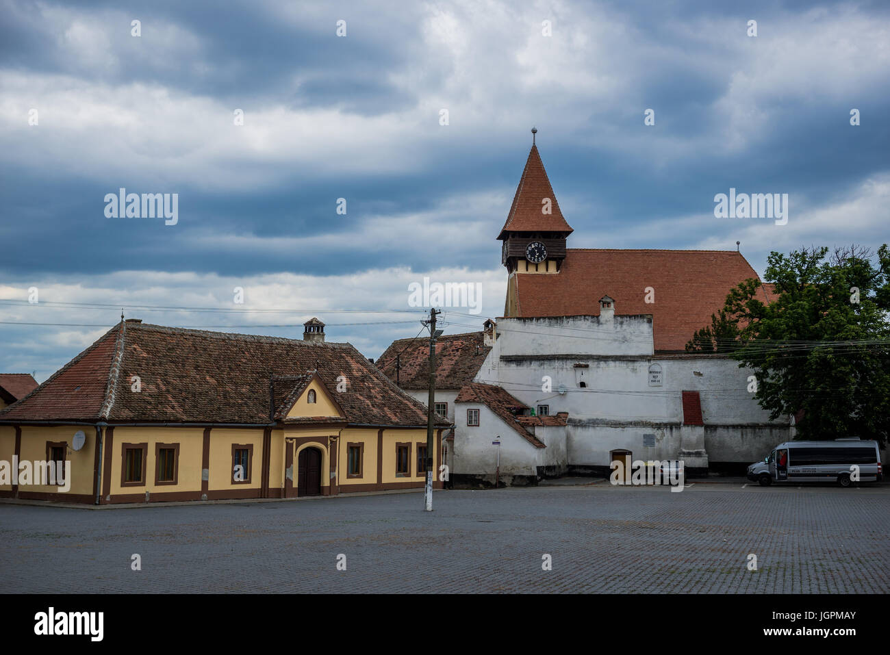 Evangelical fortified church on Central Square (Piata Centrala) in Miercurea Sibiului town of Sibiu County in southern Transylvania, Romania Stock Photo